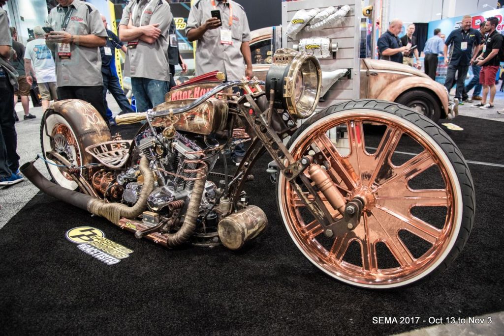 The "After Hours" custom bike and "Dung Beetle" (background) on display at the Heatshield Products booth.